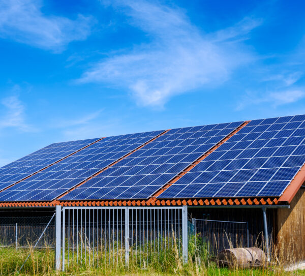Green,Energy,With,Solar,Collectors,On,The,Roof,Of,An